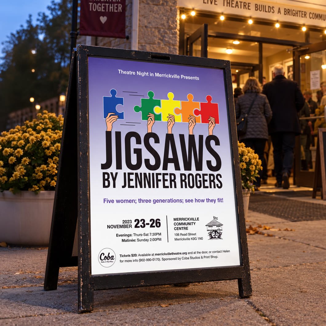 Jigsaws theatre poster in an A-frame sidewalk sign outside the Merrickville Community Centre at dusk