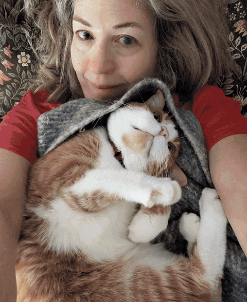 Animated photo of Sharon holding her cat